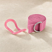 Small translucent pink loop beside a rolled pink webbing strap with one silver-coloured D-ring.